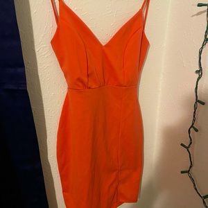 Peach colored open back dress with slit